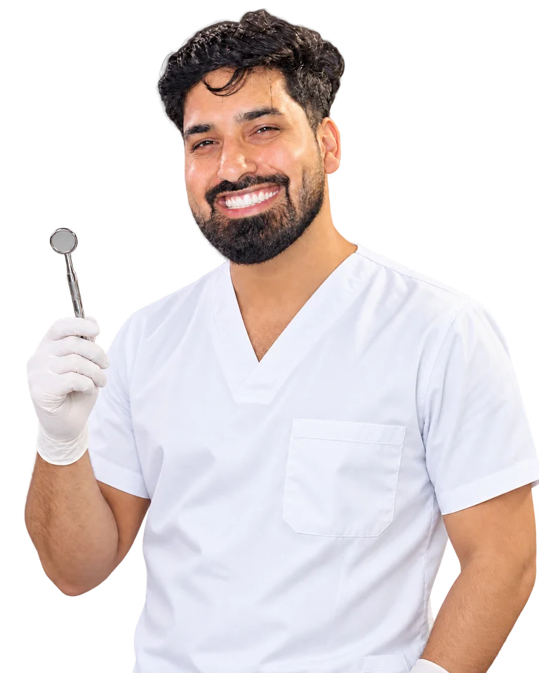 Smiling man in white dental scrubs holding a dental mirror